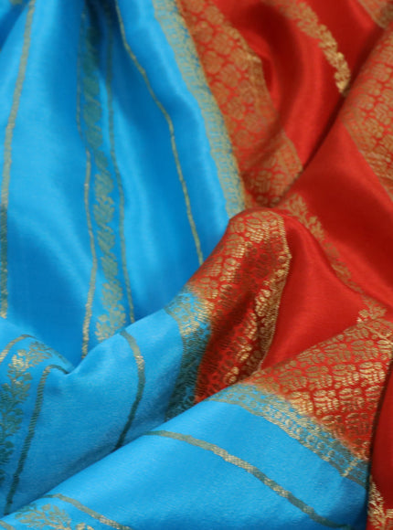 Pure mysore silk saree light blue and orange with allover zari weaves and rich zari woven border