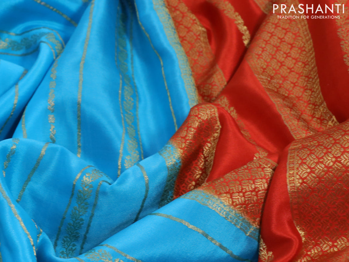 Pure mysore silk saree light blue and orange with allover zari weaves and rich zari woven border