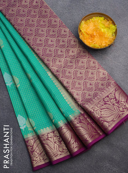 Semi crepe saree teal green and purple with allover zari checks & buttas and zari woven border