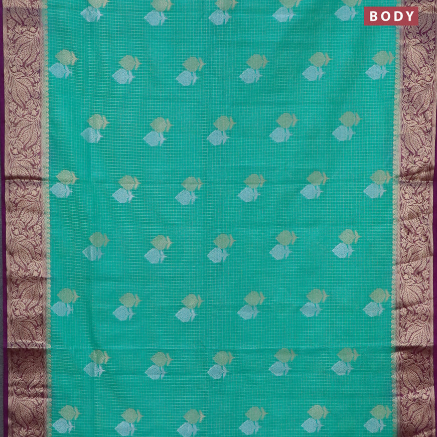 Semi crepe saree teal green and purple with allover zari checks & buttas and zari woven border