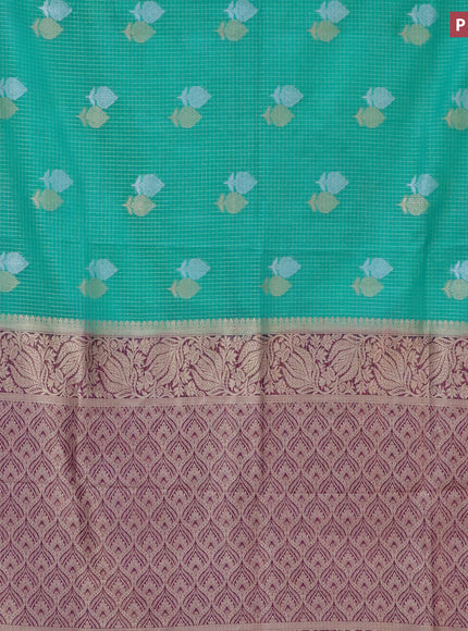 Semi crepe saree teal green and purple with allover zari checks & buttas and zari woven border