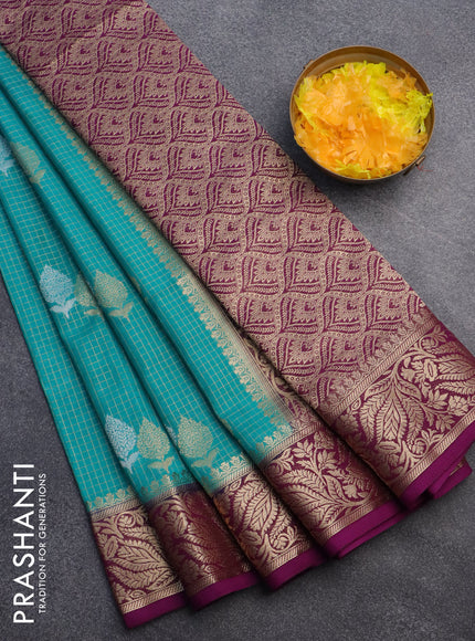 Semi crepe saree teal blue and purple with allover zari checks & buttas and zari woven border