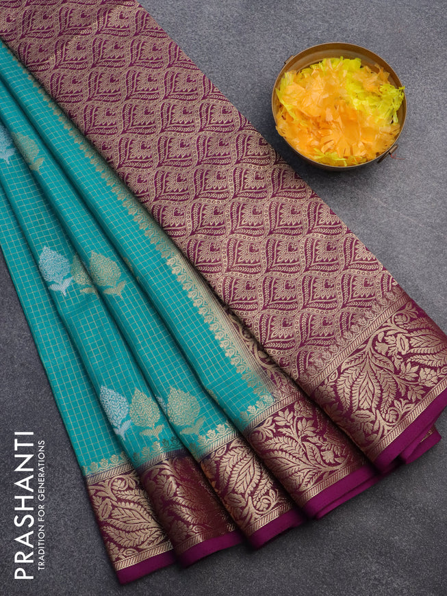 Semi crepe saree teal blue and purple with allover zari checks & buttas and zari woven border