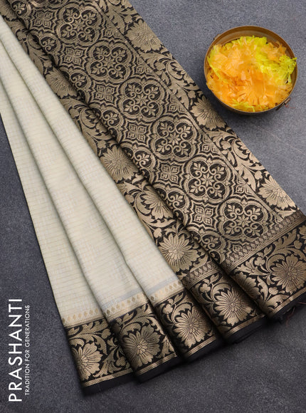 Semi crepe saree cream and black with allover zari weaves and zari woven border