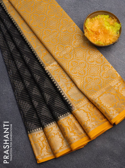 Semi crepe saree black and mango yellow with allover zari weaves and zari woven border