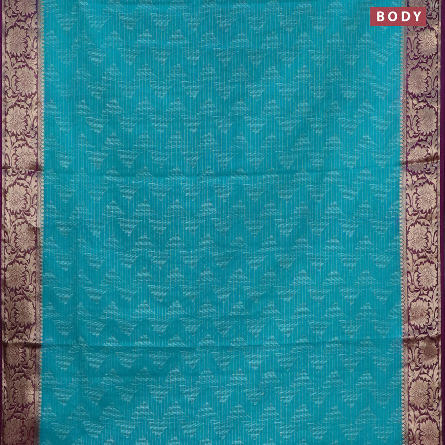 Semi crepe saree teal blue and purple with allover zari weaves and zari woven border