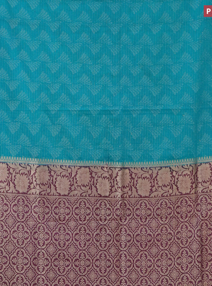 Semi crepe saree teal blue and purple with allover zari weaves and zari woven border