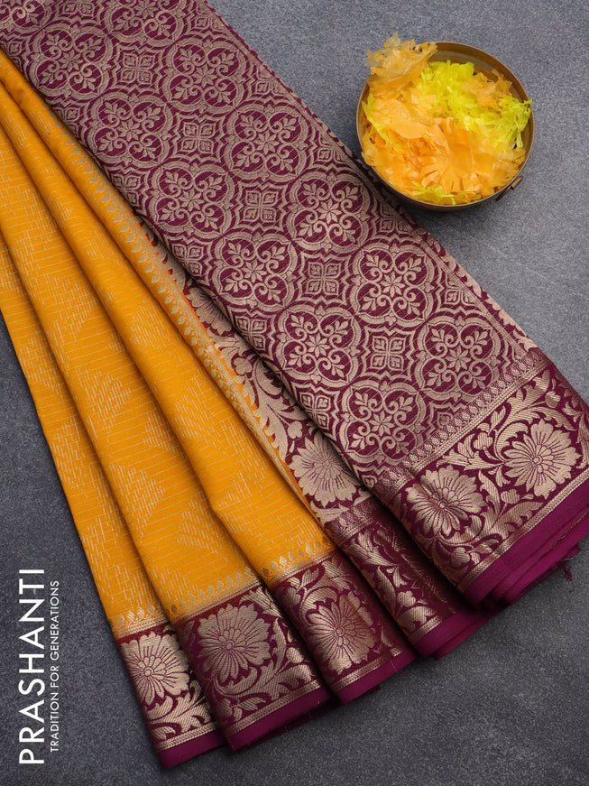 Semi crepe saree mango yellow and purple with allover zari weaves and zari woven border