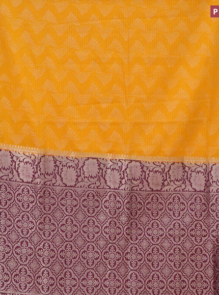 Semi crepe saree mango yellow and purple with allover zari weaves and zari woven border