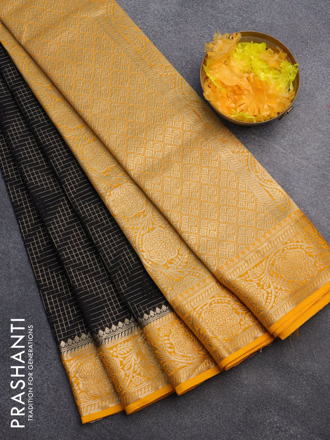 Semi crepe saree black and mango yellow with allover zari checks & self emboss butta and zari woven border