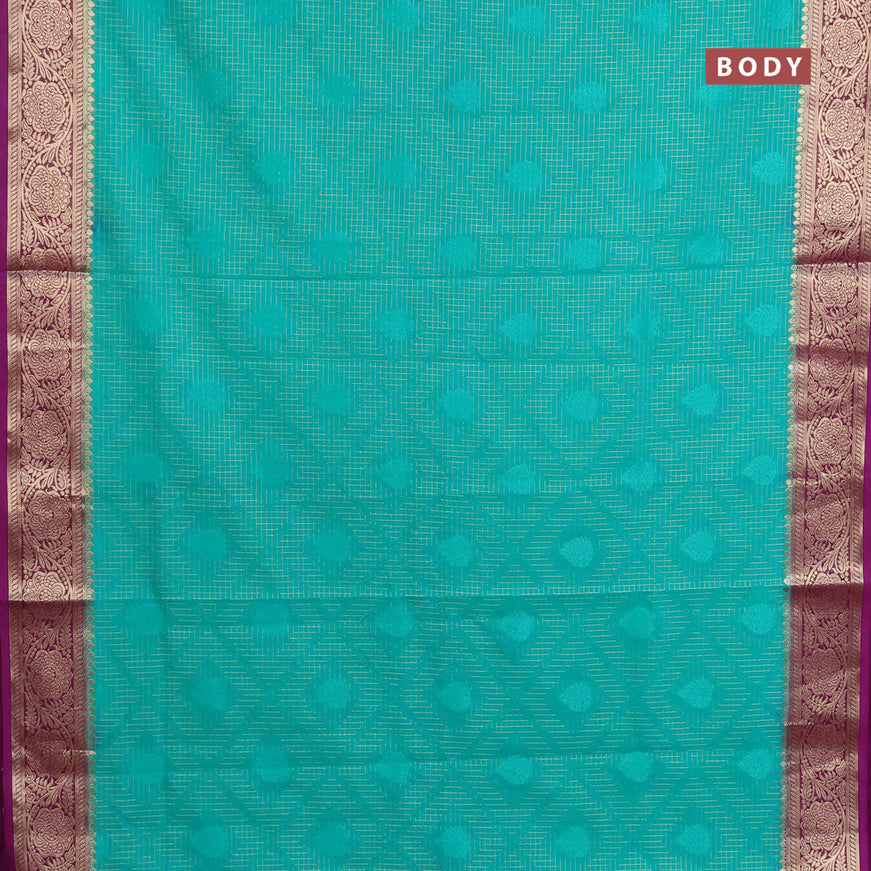 Semi crepe saree teal green and purple with allover zari checks & self emboss butta and zari woven border