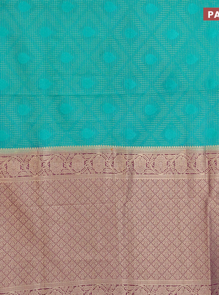 Semi crepe saree teal green and purple with allover zari checks & self emboss butta and zari woven border