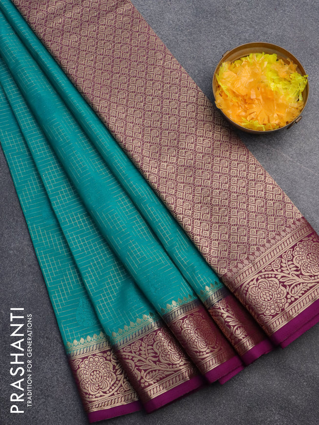 Semi crepe saree teal green shade and purple with allover zari checks & self emboss butta and zari woven border