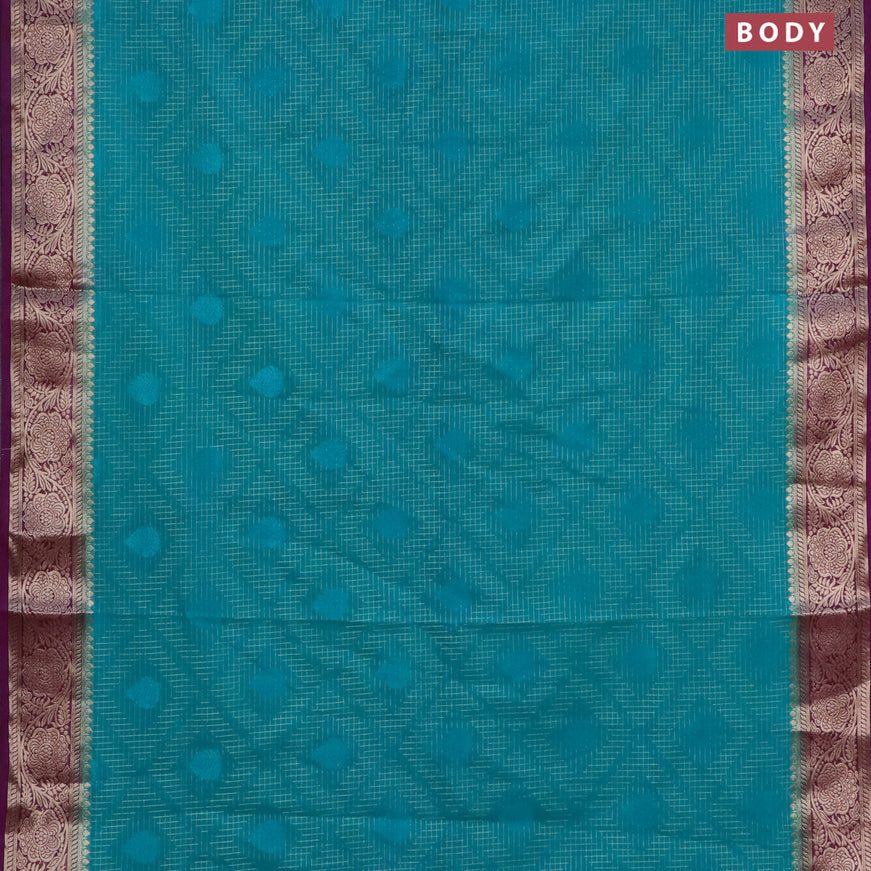 Semi crepe saree teal green shade and purple with allover zari checks & self emboss butta and zari woven border