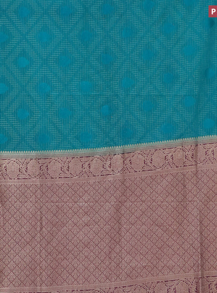 Semi crepe saree teal green shade and purple with allover zari checks & self emboss butta and zari woven border