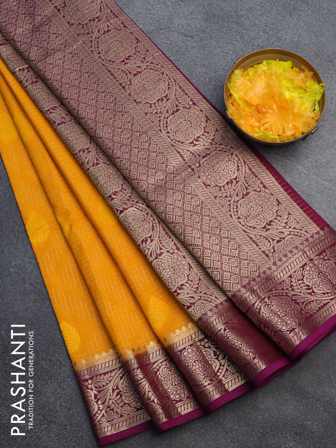 Semi crepe saree mango yellow and purple with allover zari checks & self emboss butta and zari woven border