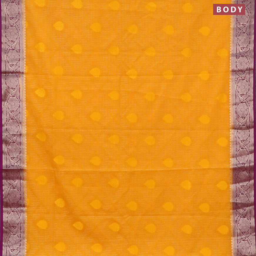 Semi crepe saree mango yellow and purple with allover zari checks & self emboss butta and zari woven border