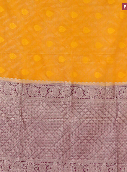 Semi crepe saree mango yellow and purple with allover zari checks & self emboss butta and zari woven border