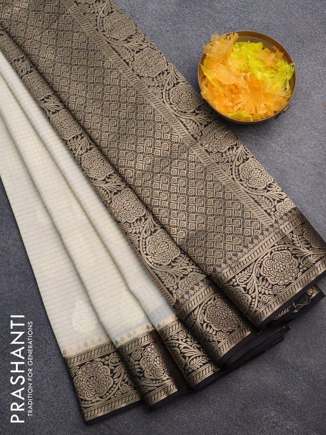 Semi crepe saree cream and black with allover zari checks & self emboss butta and zari woven border