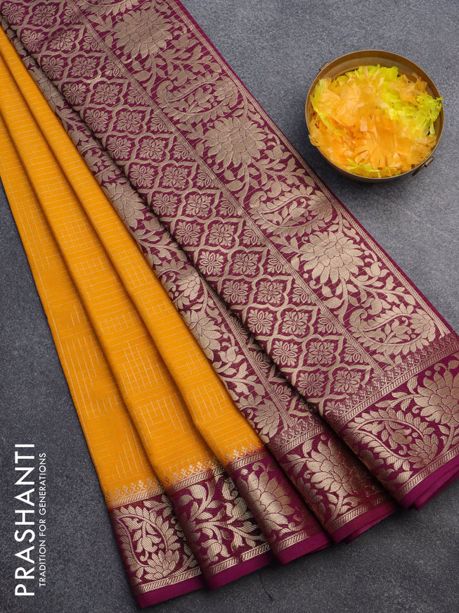 Semi crepe saree mango yellow and purple with allover zari weaves and zari woven border