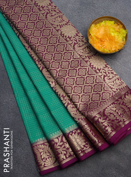 Semi crepe saree teal green and purple with allover zari weaves and zari woven border