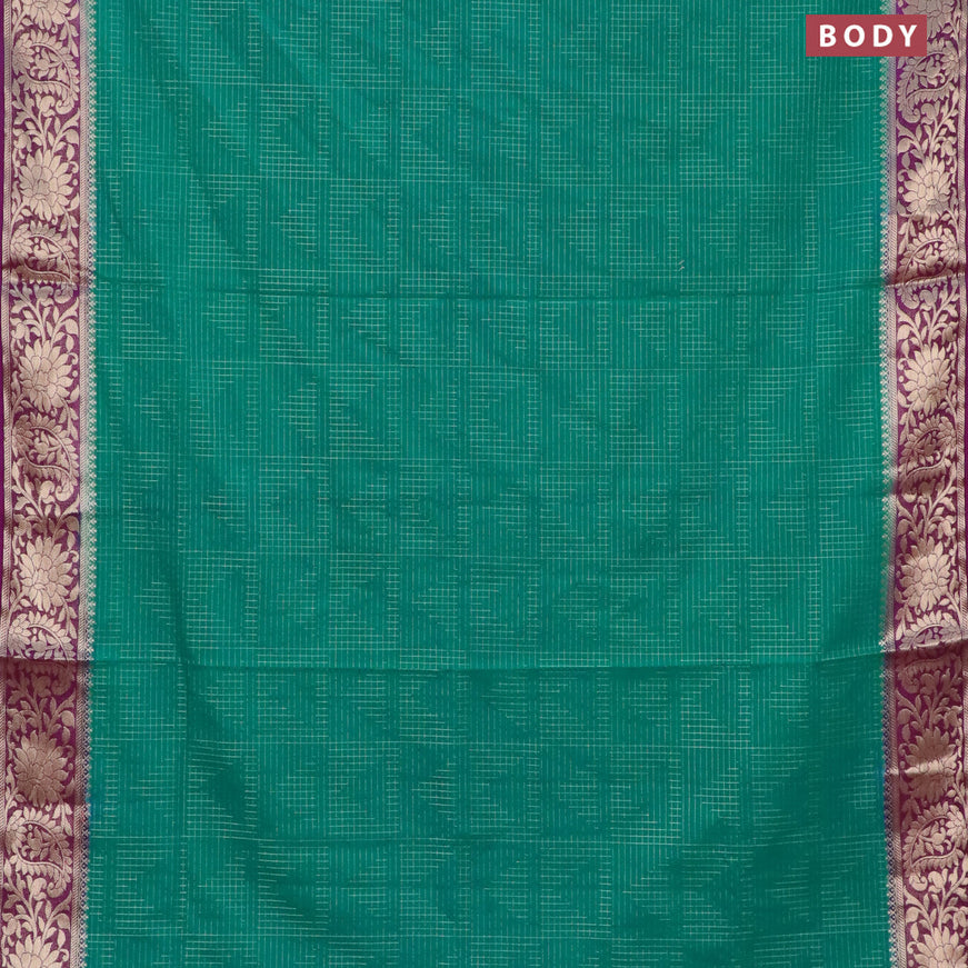 Semi crepe saree teal green and purple with allover zari weaves and zari woven border