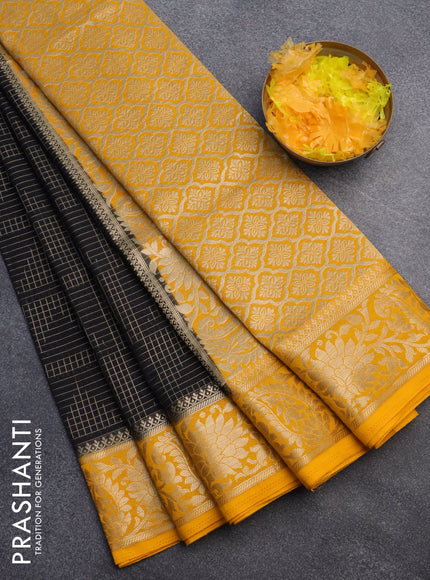 Semi crepe saree black and mango yellow with allover zari weaves and zari woven border