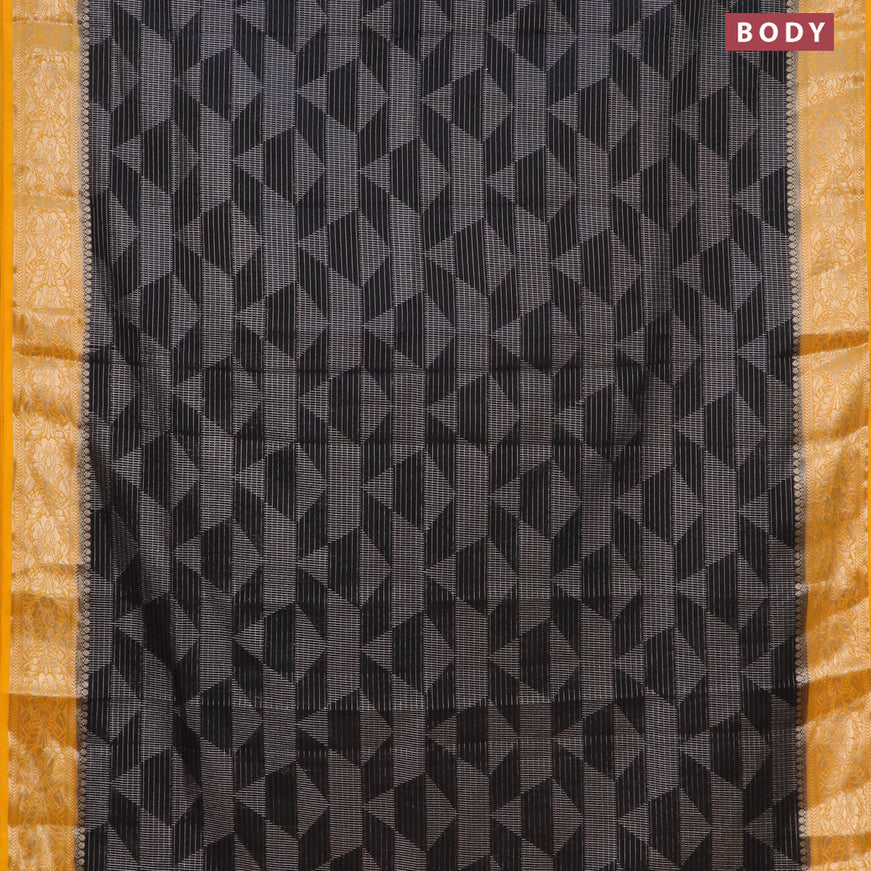 Semi crepe saree black and mango yellow with allover geometric zari weaves & self emboss and zari woven border