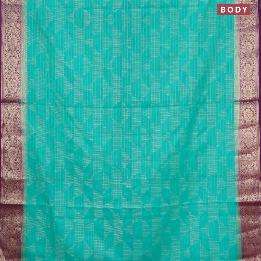 Semi crepe saree teal green and deep purple with allover geometric zari weaves & self emboss and zari woven border