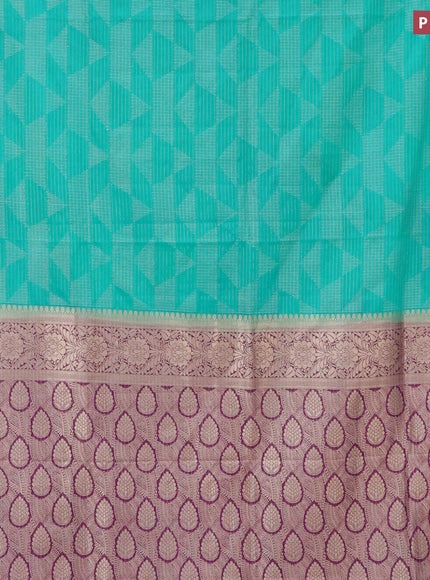 Semi crepe saree teal green and deep purple with allover geometric zari weaves & self emboss and zari woven border