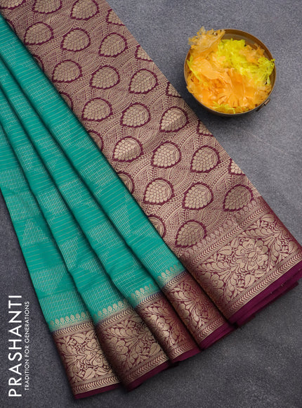 Semi crepe saree teal blue and deep purple with allover geometric zari weaves & self emboss and zari woven border