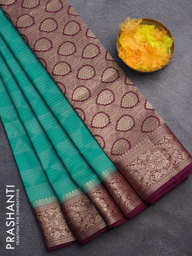 Semi crepe saree teal blue and deep purple with allover geometric zari weaves & self emboss and zari woven border