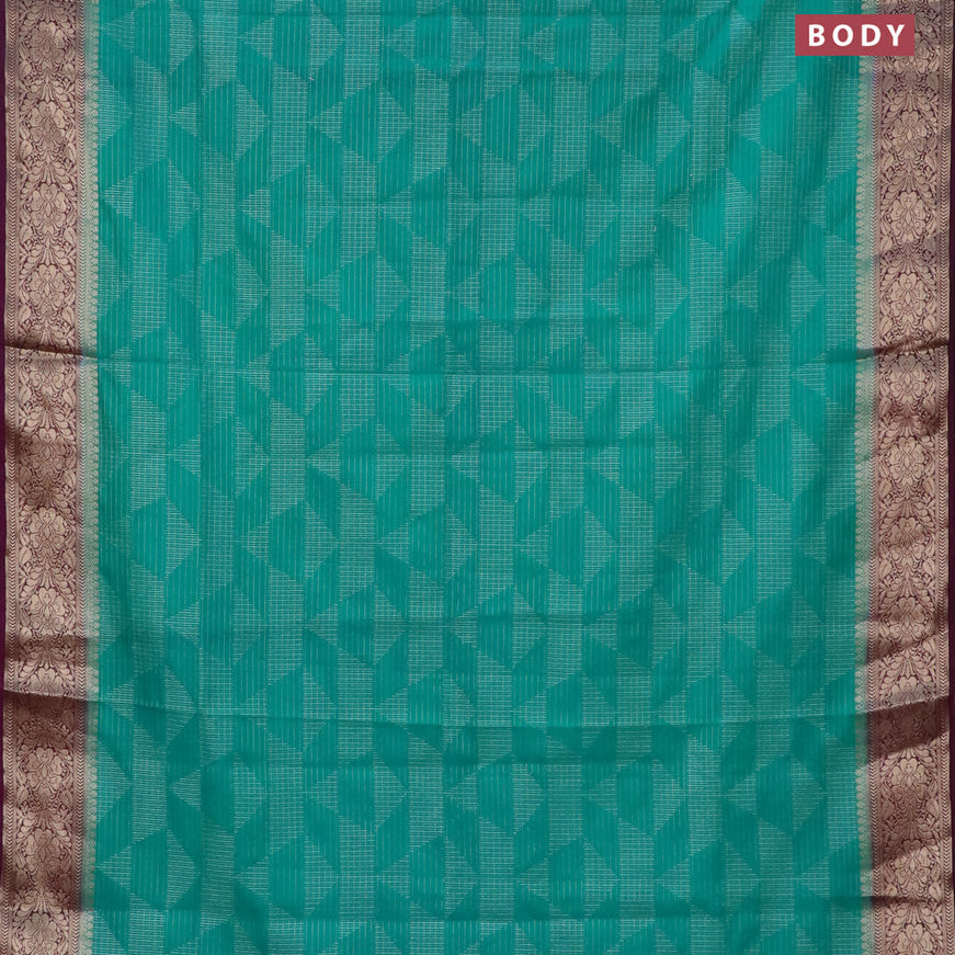 Semi crepe saree teal blue and deep purple with allover geometric zari weaves & self emboss and zari woven border