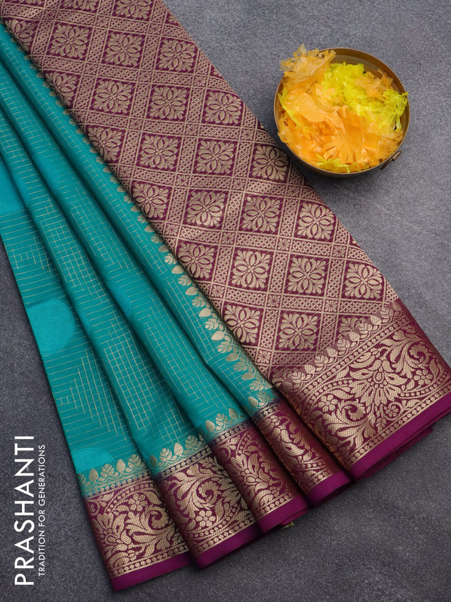 Semi crepe saree teal blue and deep purple with allover geometric zari weaves & self emboss and zari woven border