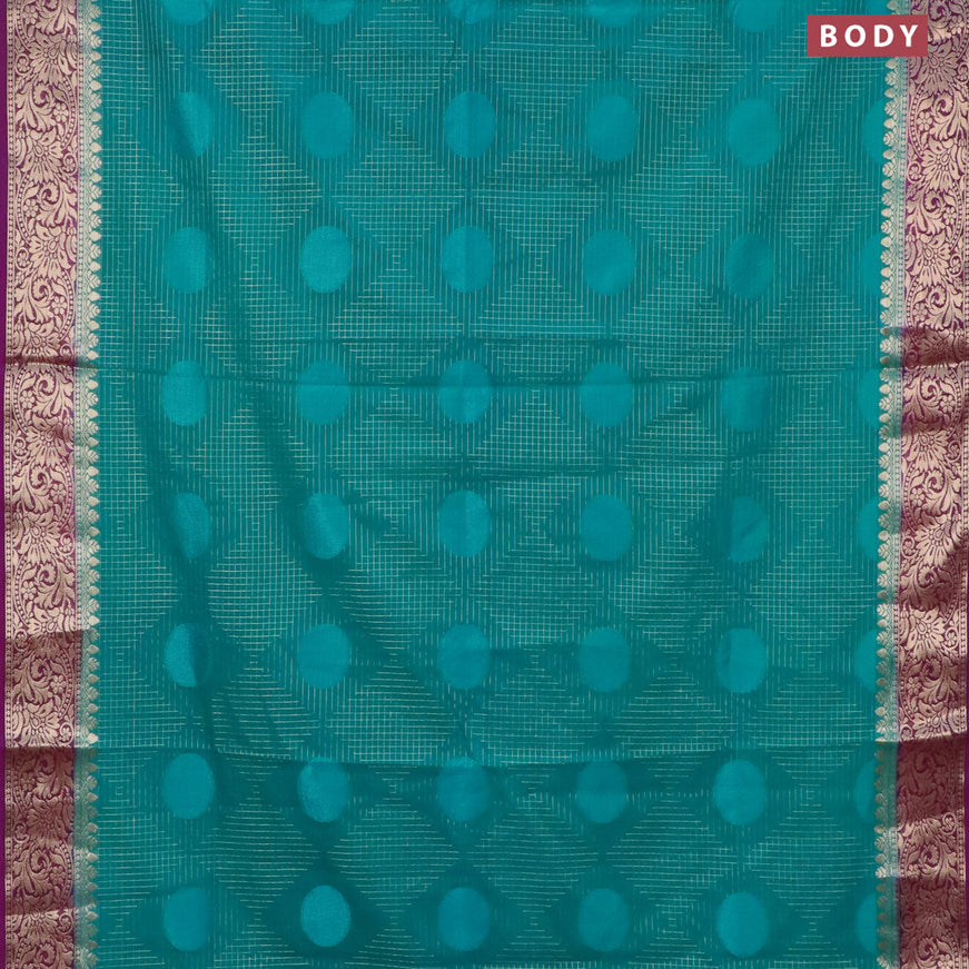 Semi crepe saree teal blue and deep purple with allover geometric zari weaves & self emboss and zari woven border