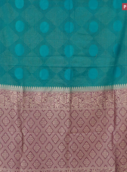 Semi crepe saree teal blue and deep purple with allover geometric zari weaves & self emboss and zari woven border