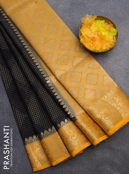 Semi crepe saree black and mango yellow with allover geometric zari weaves & self emboss and zari woven border