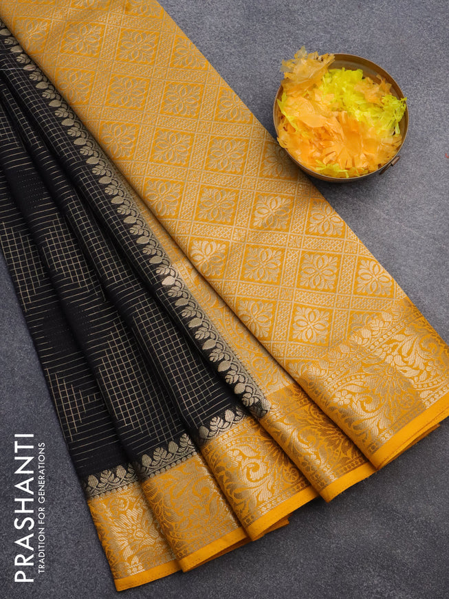 Semi crepe saree black and mango yellow with allover geometric zari weaves & self emboss and zari woven border