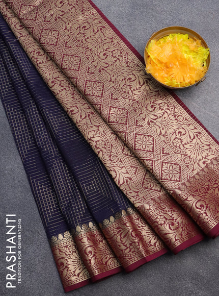 Semi crepe saree navy blue and deep maroon with allover geometric zari weaves & self emboss and zari woven border