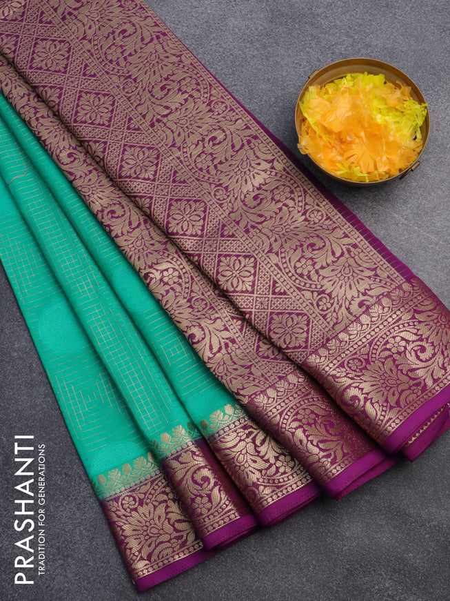 Semi crepe saree teal green and purple with allover geometric zari weaves & self emboss and zari woven border