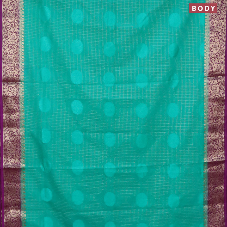 Semi crepe saree teal green and purple with allover geometric zari weaves & self emboss and zari woven border