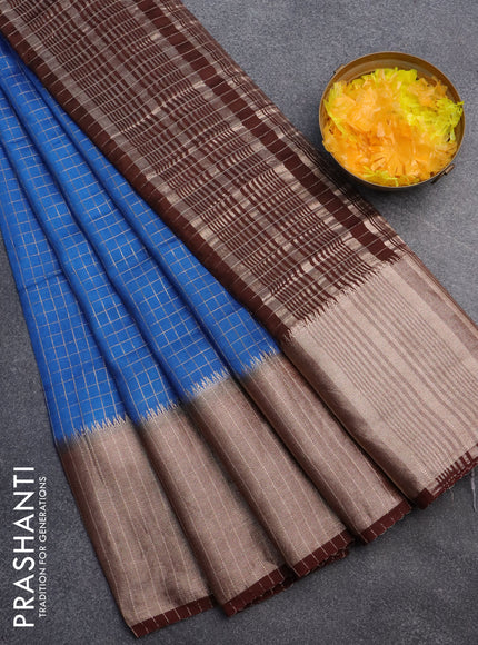 Semi crepe saree blue and coffee brown with allover small zari checked pattern and long zari woven border