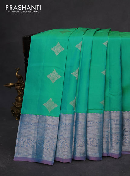 Roopam silk saree dual shade of teal green and dual shade of pastel pink with silver zari woven buttas and silver zari woven border