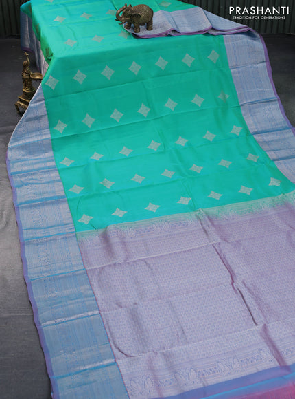 Roopam silk saree dual shade of teal green and dual shade of pastel pink with silver zari woven buttas and silver zari woven border