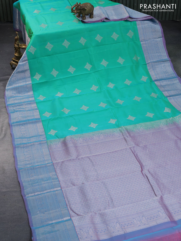 Roopam silk saree dual shade of teal green and dual shade of pastel pink with silver zari woven buttas and silver zari woven border