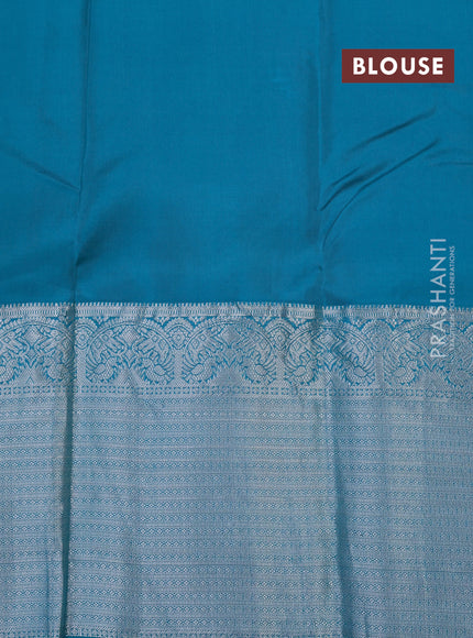 Roopam silk saree dual shade of orange and teal green with silver zari woven buttas and long silver zari woven border