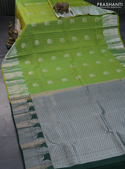 Roopam silk saree light green and dark green with allover silver zari stripes pattern & paisley buttas and silver zari woven border