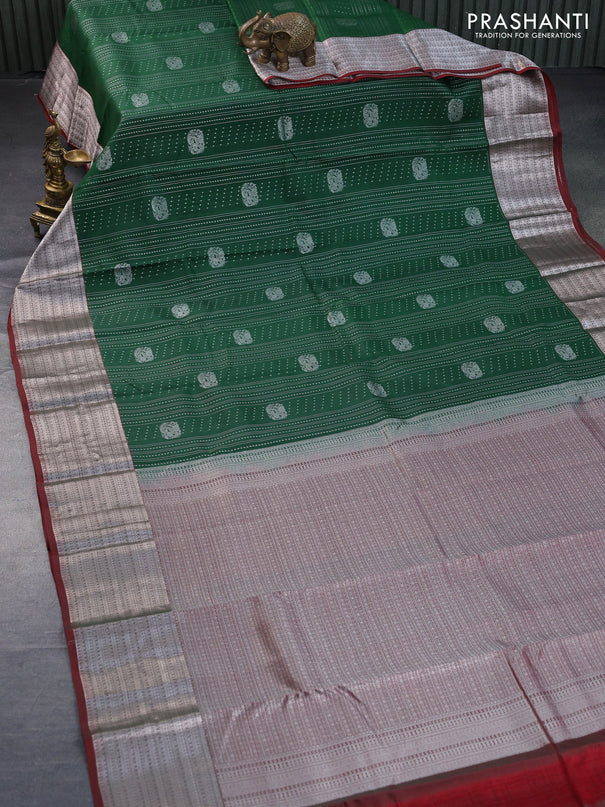 Roopam silk saree green and maroon with allover silver zari weaves and silver zari woven border