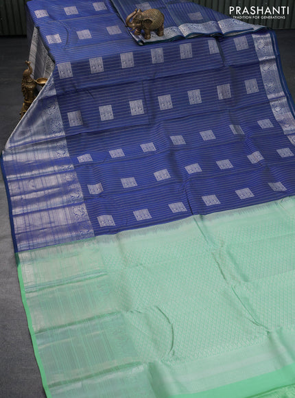 Roopam silk saree dual shade of blue and pastel green with allover silver zari weaves & buttas and long silver zari woven border