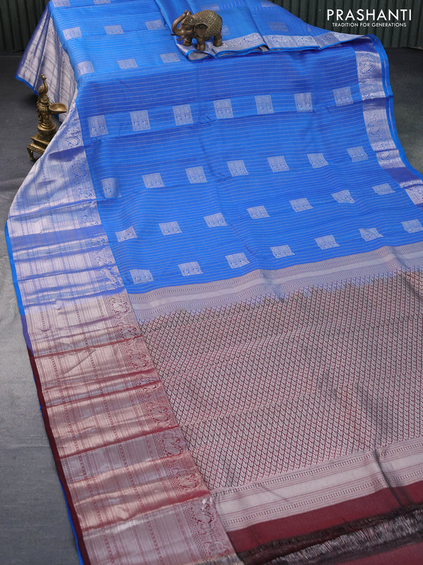 Roopam silk saree cs blue and deep maroon with allover silver zari weaves & buttas and long silver zari woven border